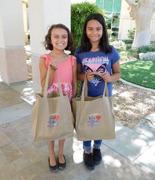 2 girls with donations