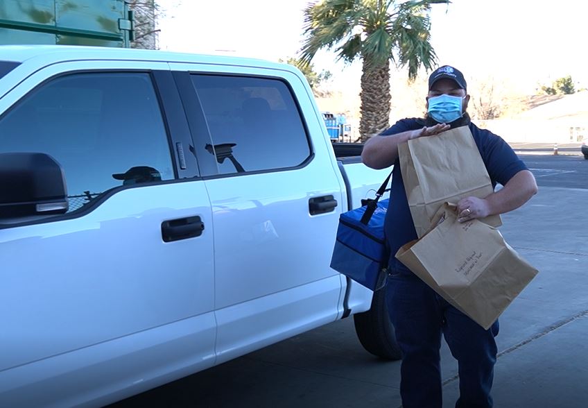 Man holding 2 paperbags