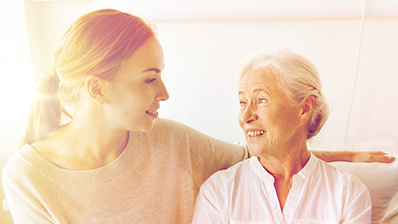 young woman talking to an older woman